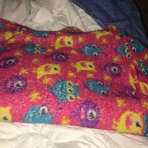 a red with monsters on it blanket